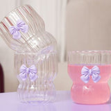 DRINKING GLASS WITH EMBOSSED PURPLE BOW OUTSIDE
