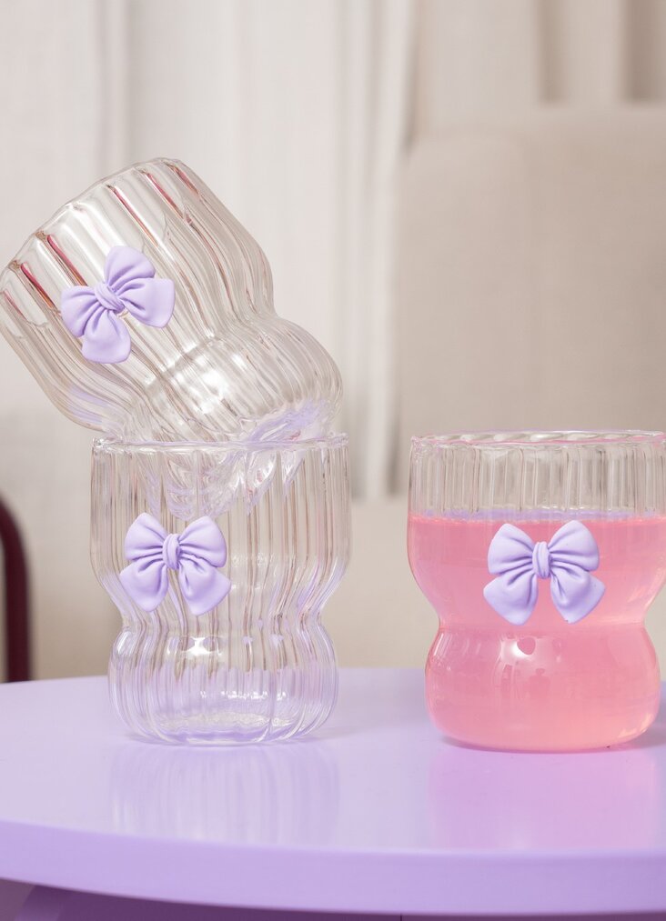DRINKING GLASS WITH EMBOSSED PURPLE BOW OUTSIDE