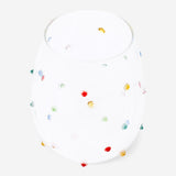 Drinking glass with multi coloured dots 