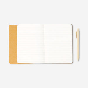 Butter yellow notebook with ballpoint pen