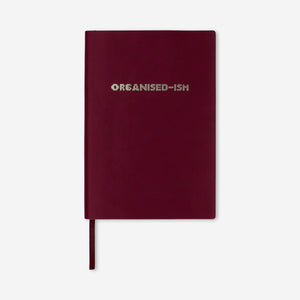 Burgundy notebook with text 