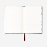 Burgundy notebook with text 