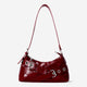 Red shoulder bag with buckles