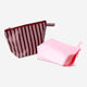 Pink and brown toiletry bags 